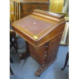 A Victorian walnut Davenport having a hinged top and four drawers to the side, 33" h x 21"w