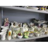 A quantity of china and ceramics to include Wedgwood, Derby, Toby Jugs and others