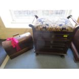 An early 20th century mahogany piano stool with upholstered and hinged seat, three drawers and a