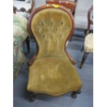 A Victorian mahogany framed, button spoon back salon chair