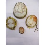 A group of yellow metal cameo brooches. Location:Cab