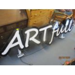 A large light-up Artful sign 94 1/2" x 26 1/2". Location:RAM