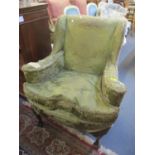 An early 20th century armchair having walnut cabriole front legs