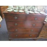 An early 19th century mahogany chest of two short and three long drawers having ring handles and