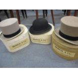 Hillhouse & Co, three gents hats comprising a bowler hat and two grey top hats together with three