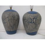 A near pair of Louise Darby studio pottery table lamps of baluster form, one decorated with fish and
