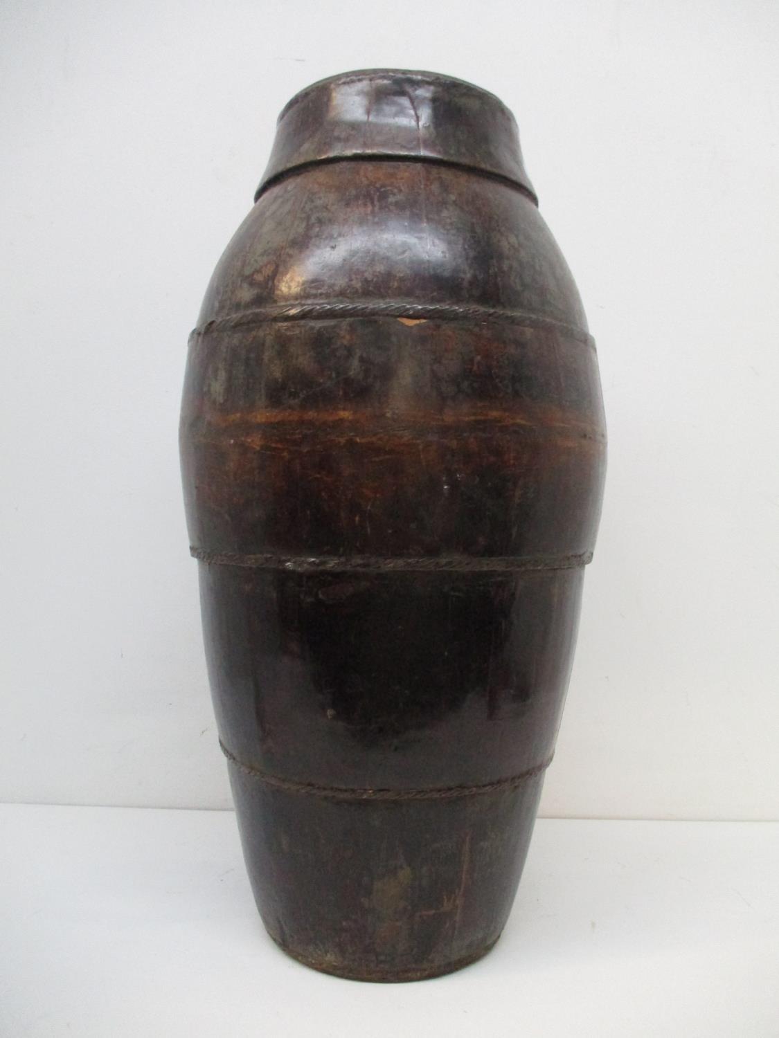 A 19th century Chinese coopered wooden, floor standing barrel of tapered form, with woven metal - Image 5 of 7