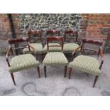 A set of six Regency brass inlaid mahogany dining chairs, with a tablet and rope-twist bar back