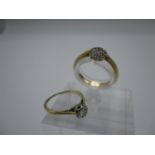 Two gold rings one set with seven diamonds, stamped 18 and the other a solitaire diamond ring in