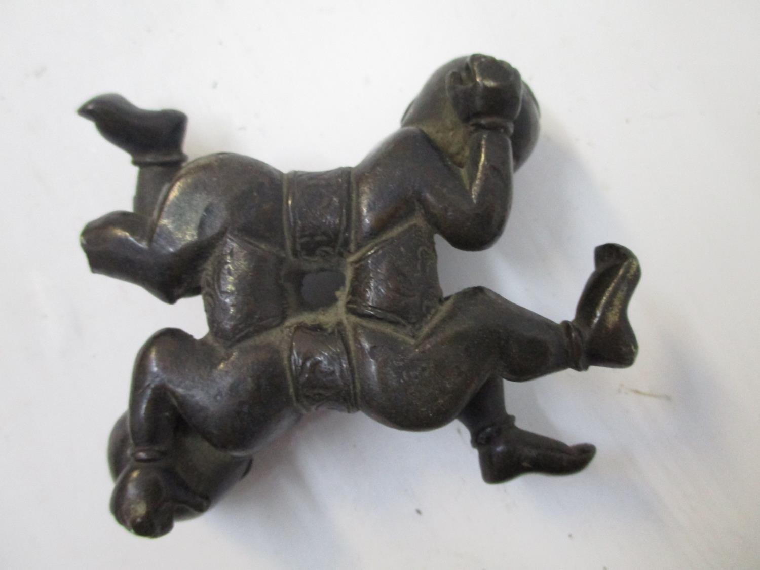 A late 19th century Chinese bronze group of two children head to foot, lying on their sides, 2 1/2"w - Image 2 of 3