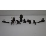 Seven Austrian miniature, cold painted bronze figures, two of young children pulling a baby on a