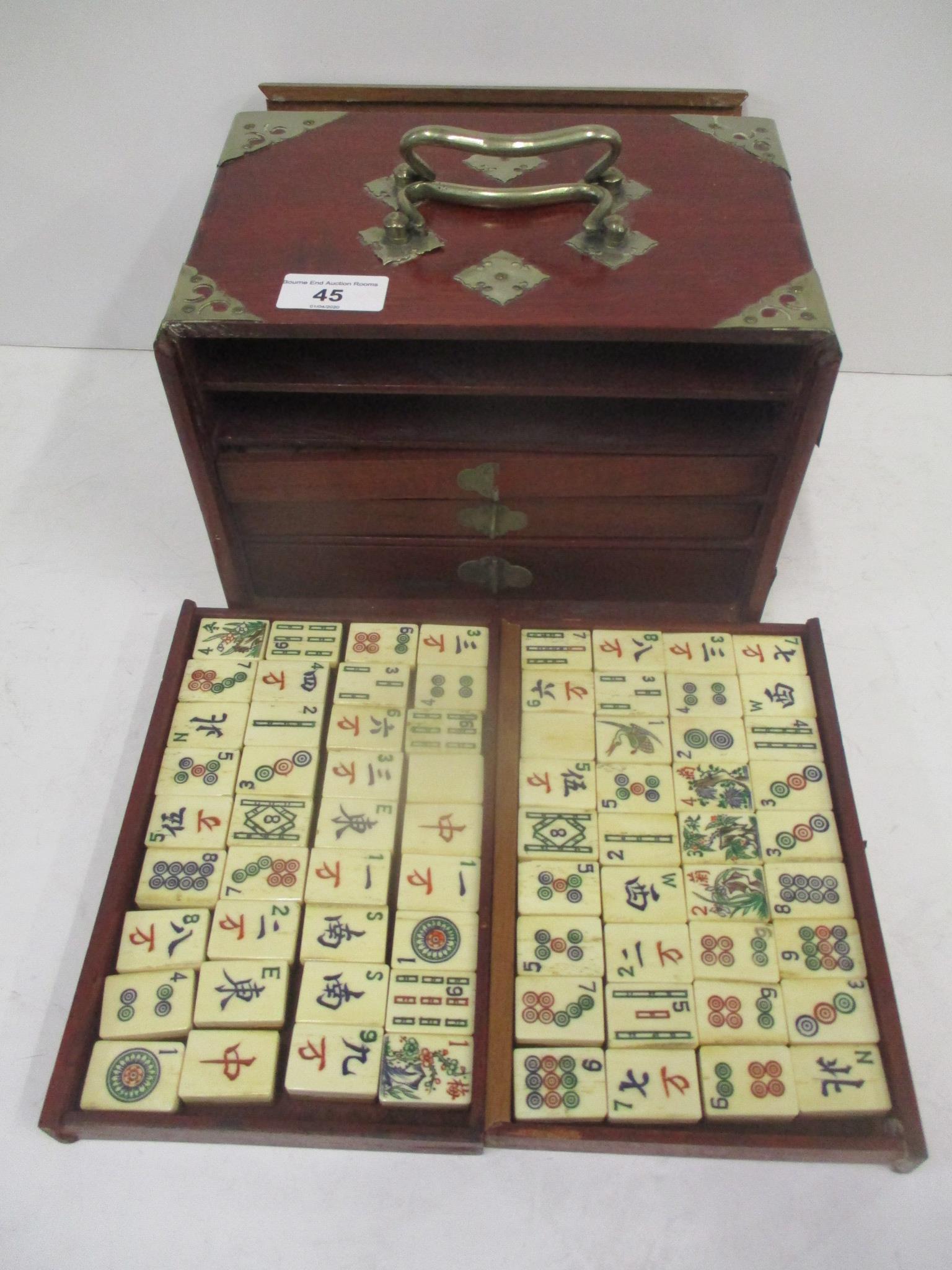 A mid 20th century Chinese Mah Jong set with one hundred and forty eight bone and bamboo tiles,