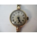 A Tudor 9ct gold cased ladies wristwatch on a flexible stamp with a cream dial and Arabic