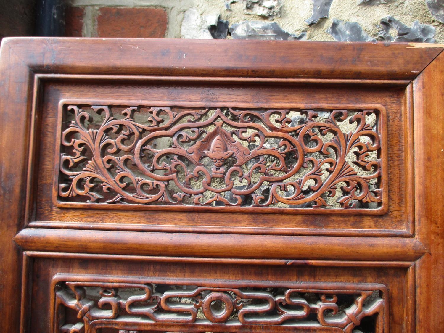 A 20th century Chinese elm four fold screen, with carved and pierced panels, decorated with animals, - Image 2 of 9