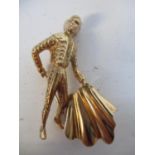 A gold coloured metal pendant fashioned as a matador, stamped 12B, 6g