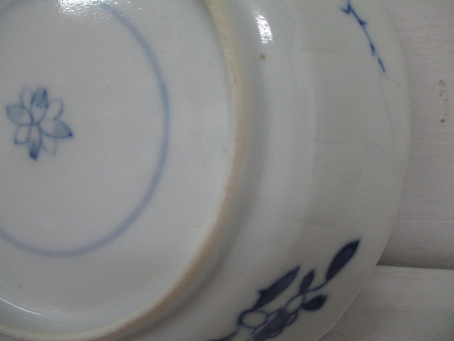 An early 18th century Kangxi blue and white cup and saucer, each with a fared wavy lip, the cup - Image 6 of 6