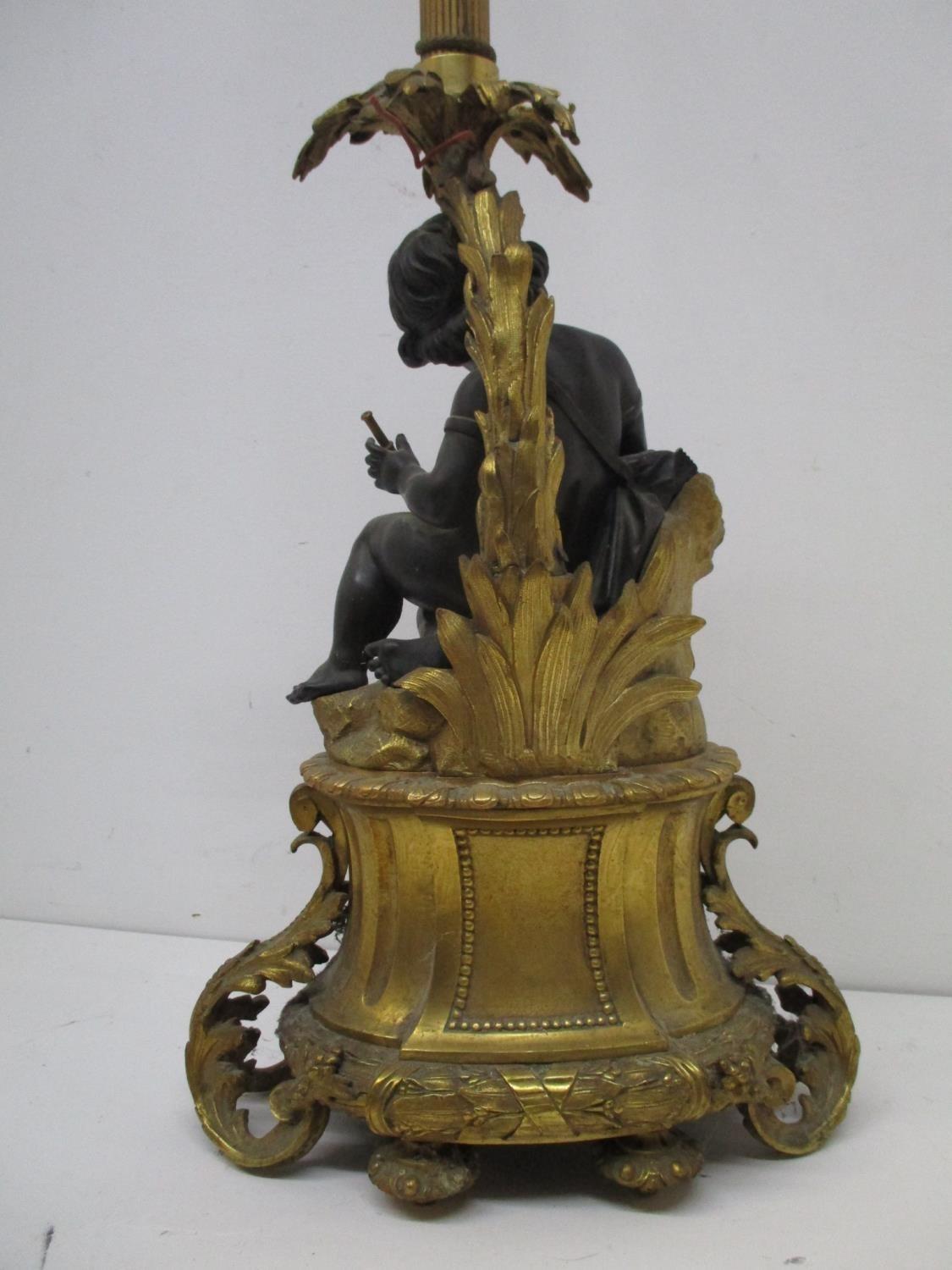 A late 19th century gilt and patinated bronze lamp base, fashioned as a young girl holding a - Image 6 of 9