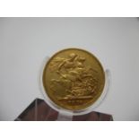A Victorian gold full sovereign with St George to the obverse 1876
