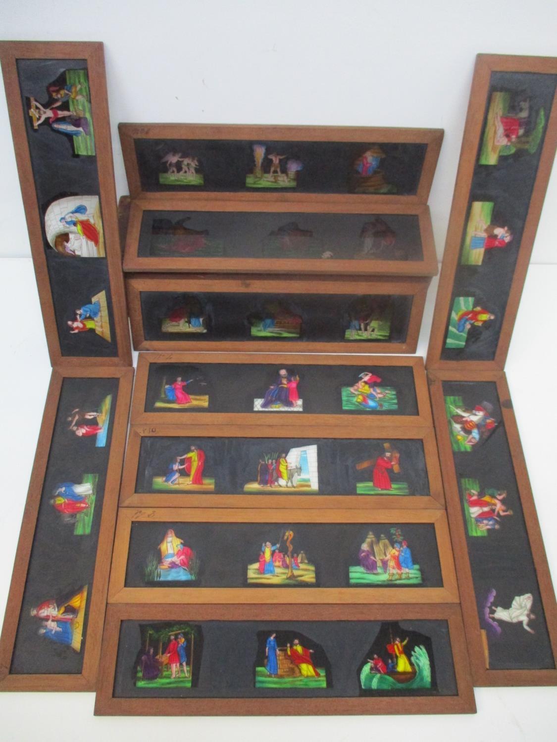 A set of twelve religious magic lantern slides each with three scenes in mahogany frames, 4" h x