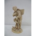 A late 19th century Japanese carved ivory figure of a man with a basket containing shells over his
