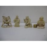 Four late 19th/early 20th century Japanese carved ivory figures, one of a man sitting cross legged