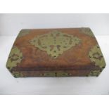 A Victorian walnut playing cards box, the arched lid decorated with engraved and pierced brass
