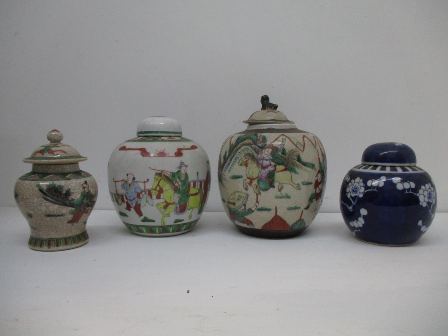 Japanese ceramics to include an Imari blue and white ginger jar decorated with figures and a crackle