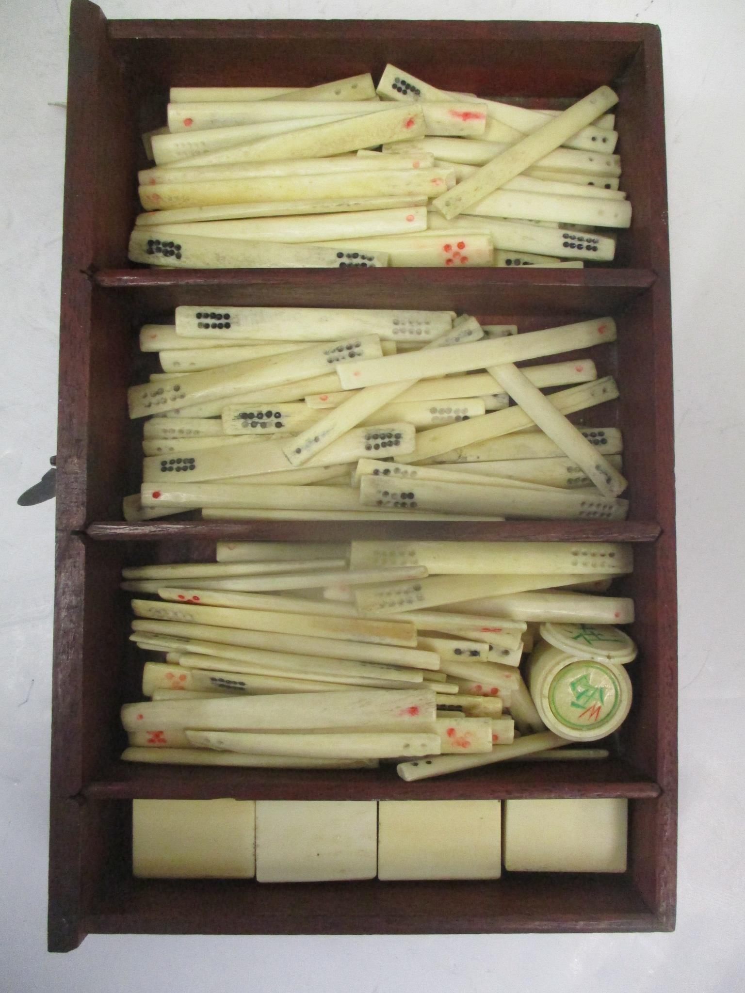 A mid 20th century Chinese Mah Jong set with one hundred and forty eight bone and bamboo tiles, - Image 4 of 8