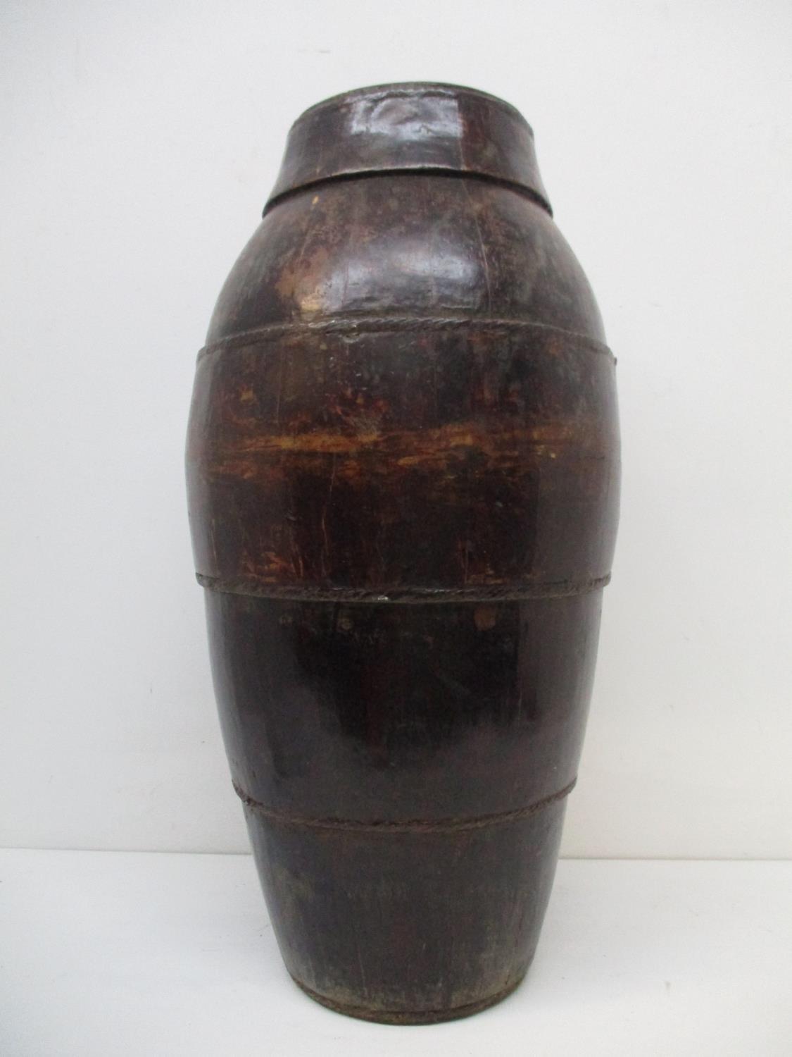 A 19th century Chinese coopered wooden, floor standing barrel of tapered form, with woven metal - Image 2 of 7