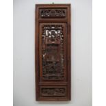 A 19th century Chinese pine panel with a moulded frame, carved and pierced panels of animals,