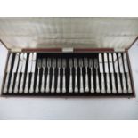 A set of twelve George IV silver handled, Kings pattern dessert knives and forks by Unite & Hillard,