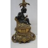 A late 19th century gilt and patinated bronze lamp base, fashioned as a young girl holding a
