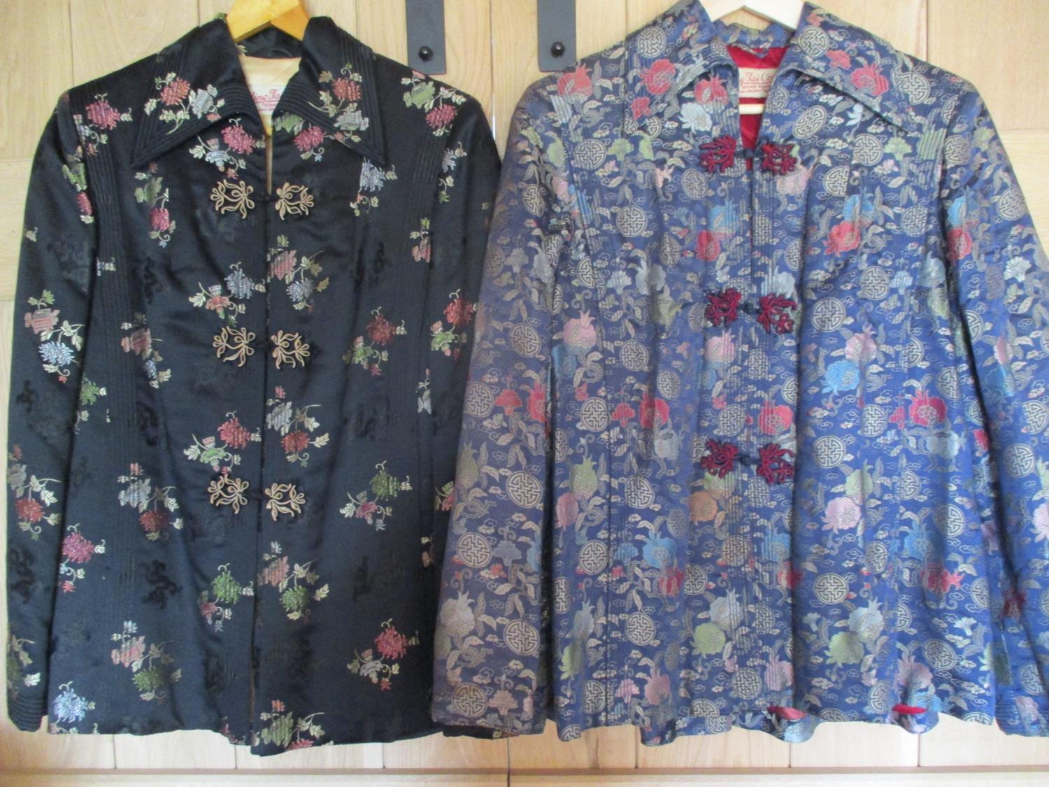 Two mid 20th century Chinese embroidered silk jackets in colourful flowers and pagoda designs,