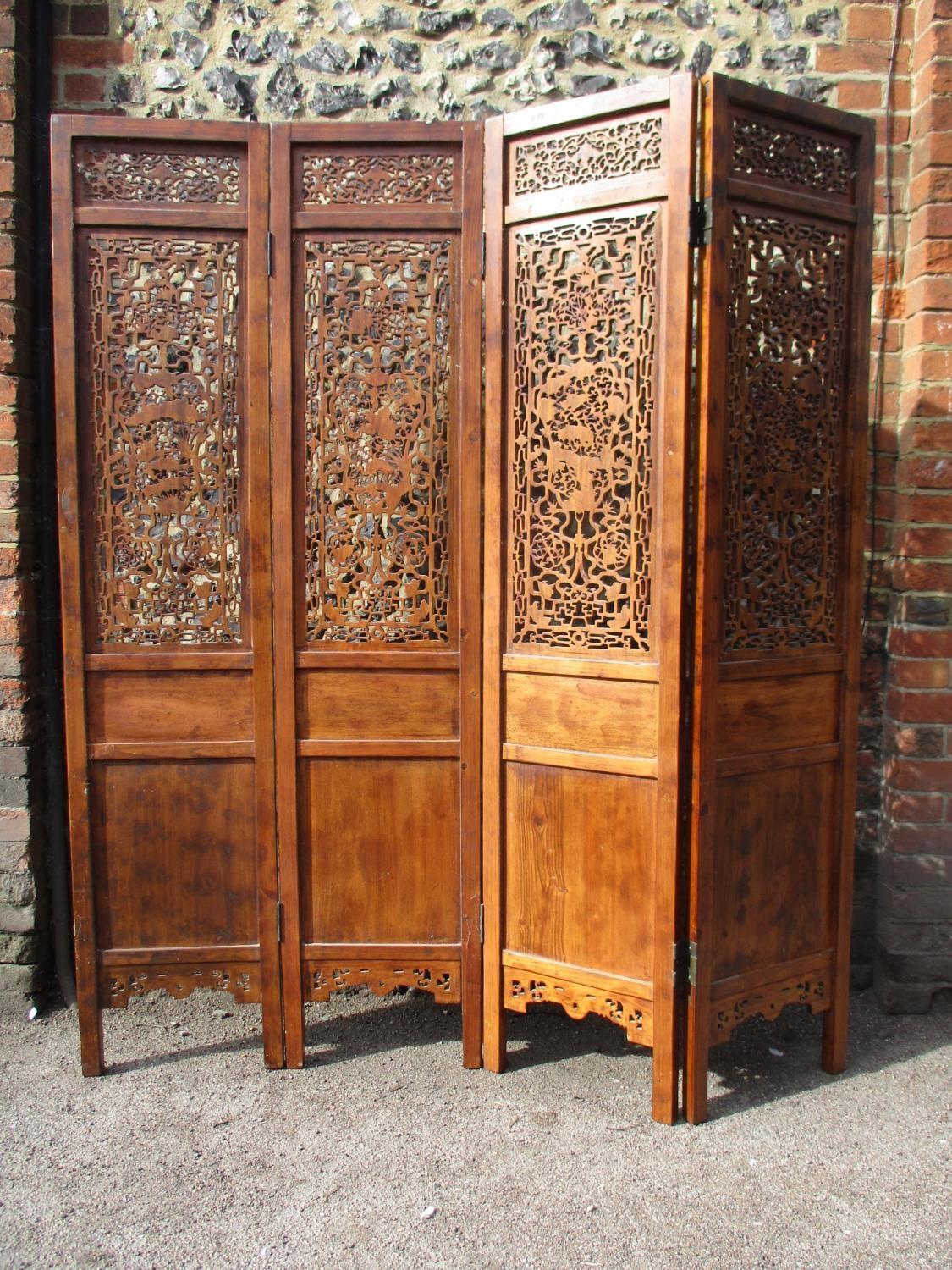 A 20th century Chinese elm four fold screen, with carved and pierced panels, decorated with animals, - Image 8 of 9