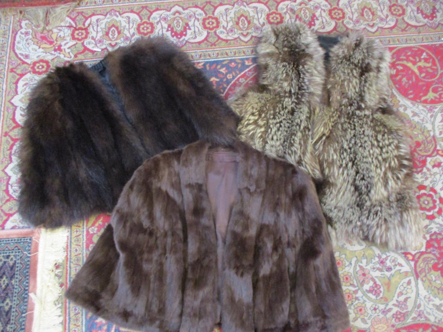 A wolf fur waistcoat, a vintage dark brown cape and a vintage dark brown mink cape