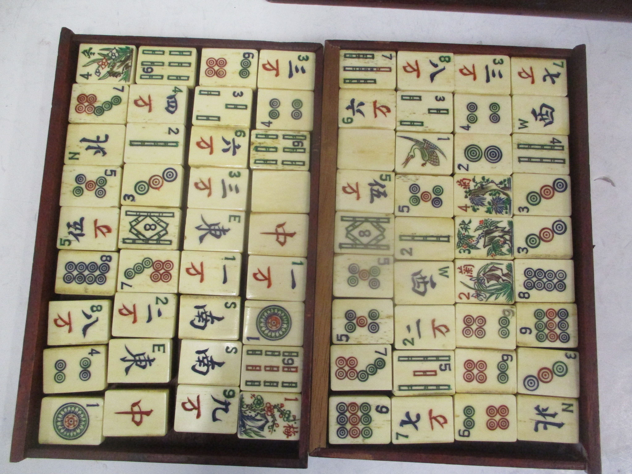 A mid 20th century Chinese Mah Jong set with one hundred and forty eight bone and bamboo tiles, - Image 2 of 8