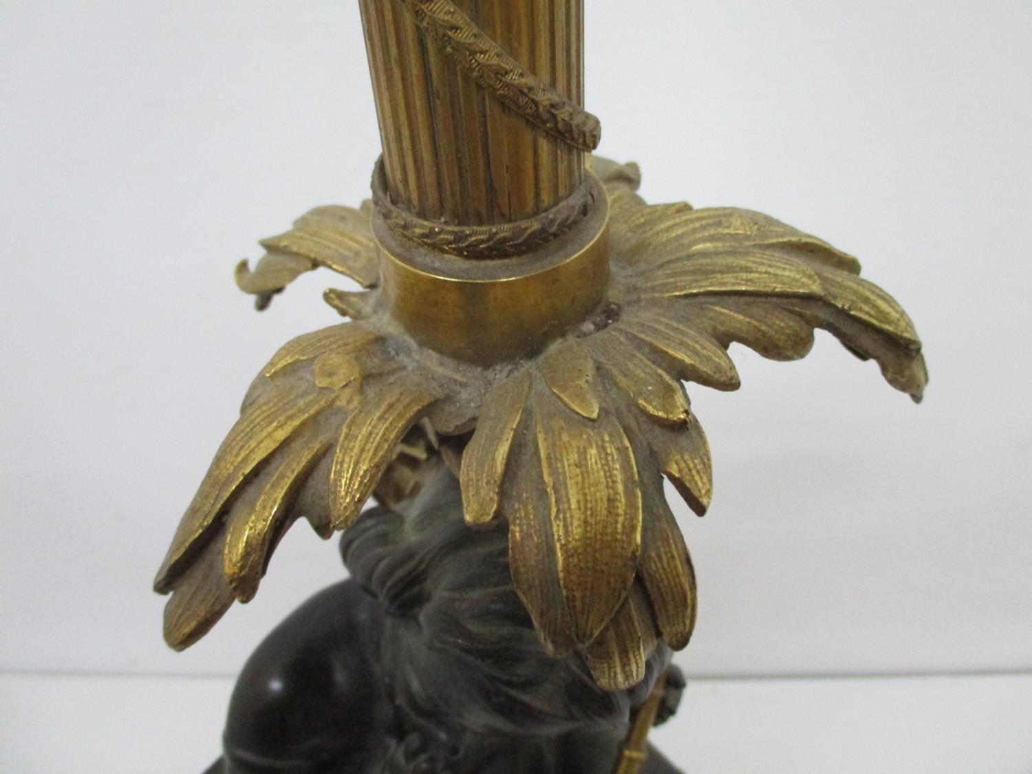 A late 19th century gilt and patinated bronze lamp base, fashioned as a young girl holding a - Image 4 of 9