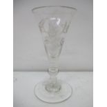 A George III gin glass the conical bowl engraved with two flowers and stems, on a knopped stem and