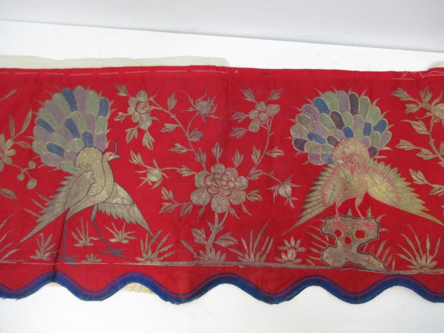 A 19th/20th century Chinese silk embroidered panel decorated with three peacocks, insects and