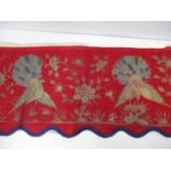 A 19th/20th century Chinese silk embroidered panel decorated with three peacocks, insects and