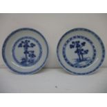 A pair of Nankin Cargo dishes decorated with two trees and two bands in blue and white, 4" dia, each