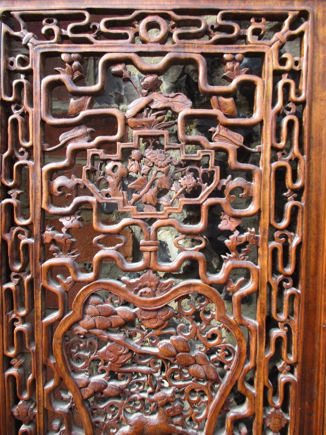 A 20th century Chinese elm four fold screen, with carved and pierced panels, decorated with animals, - Image 3 of 9