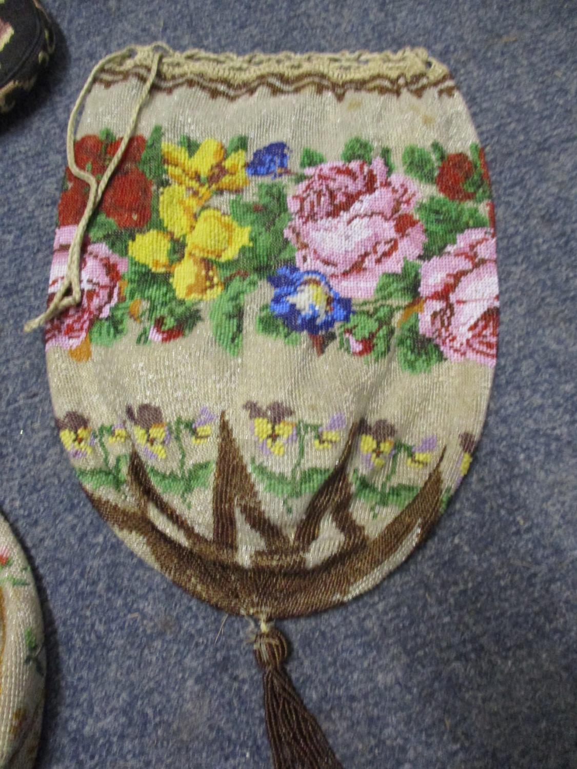 Two mid 20th century oriental style parasols depicting tulips, together with an early 20th century - Image 3 of 4