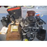 Cameras and accessories with binoculars and opera glasses