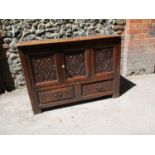 A 17th century oak coffer converted to have two cupboard doors above two short drawers, 31 1/4"h x