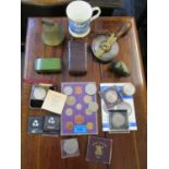 A mixed lot to include various commemorative and other coins, a tartan box, steel and brass tape