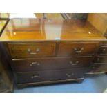 A late Victorian/early Edwardian straight fronted chest of two short and two long drawers on bracket