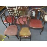 A selection of Victorian and later chairs to include a horseshoe shaped armchair