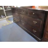 A Stagg mahogany low chest of four short drawers over two sets of longer drawers on bracket feet