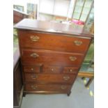 A Stagg mahogany chest of two long drawers above three small central drawers and a further two